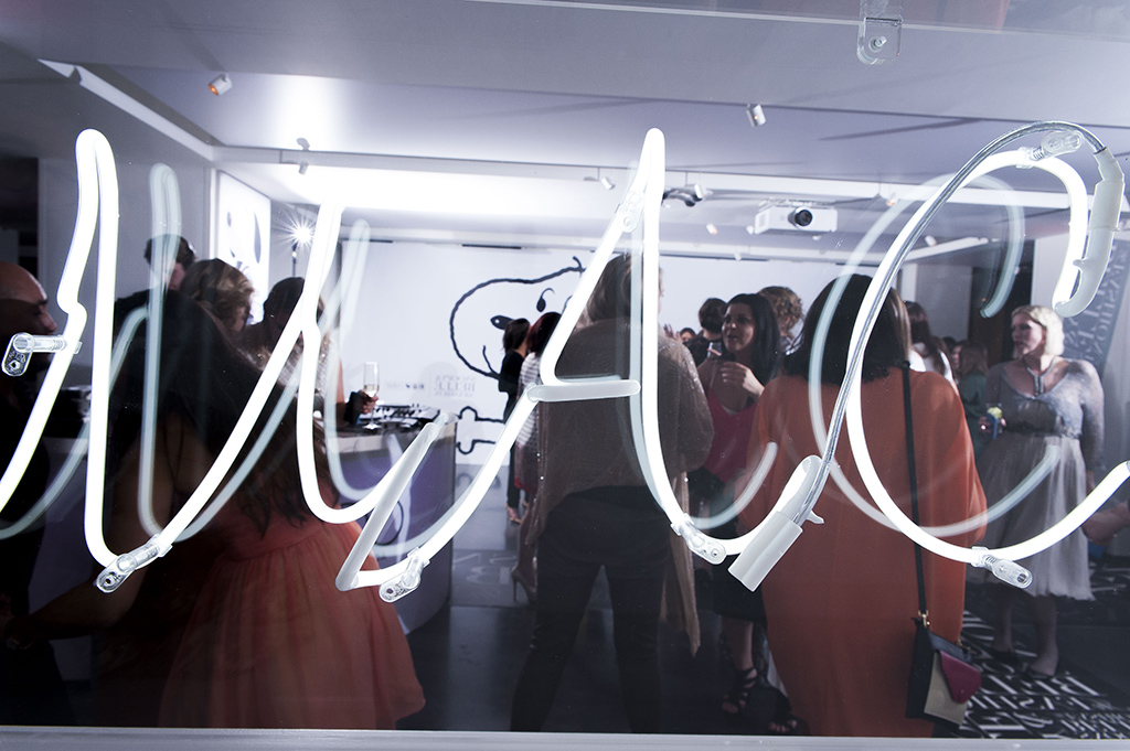 Rob Cartwright London corporate event photographer MAC makeup cosmetics teambuilding party neon sign lettering white